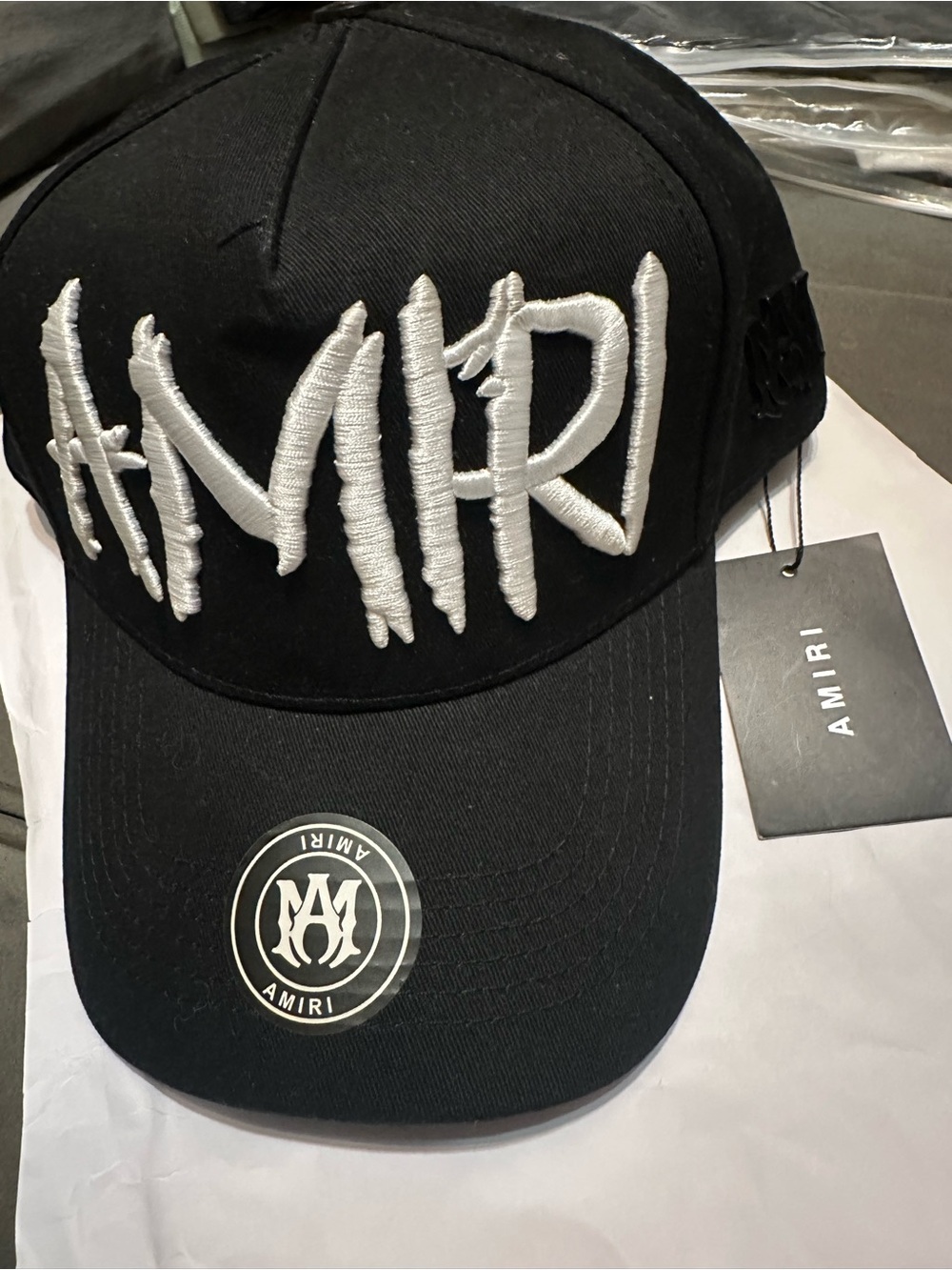 AMIRI Black Cap with White Raised Script Logo